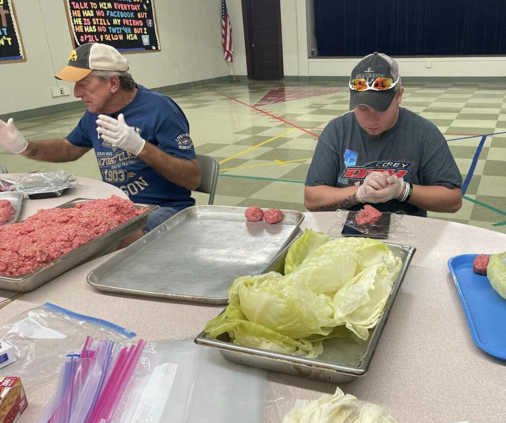 Burlington Noon Lions volunteers stuff cabbage rolls